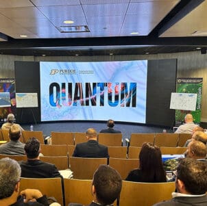 A crowd sits in the CIVS theater.