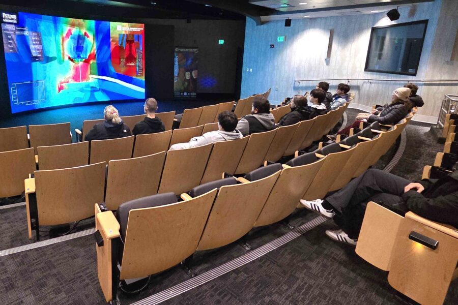 students watching theater screen