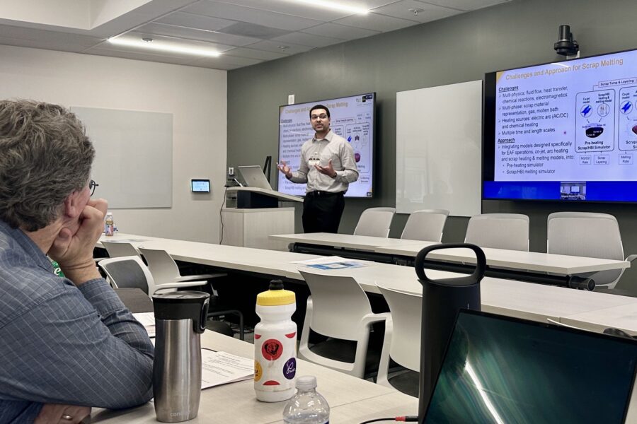 Ty Okosun presenting to audience