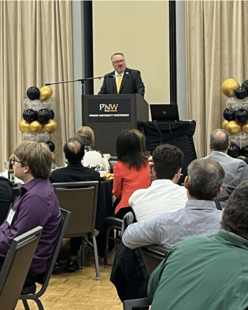 Chancellor Holford speaking to audience