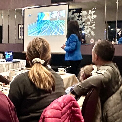 Chenn Zhou presenting to audience