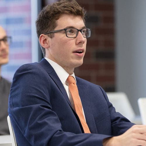 Student in middle of discussion in classroom