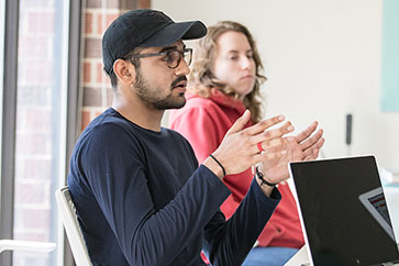 Male student talking in class