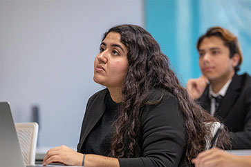 A PNW student looking at her professor