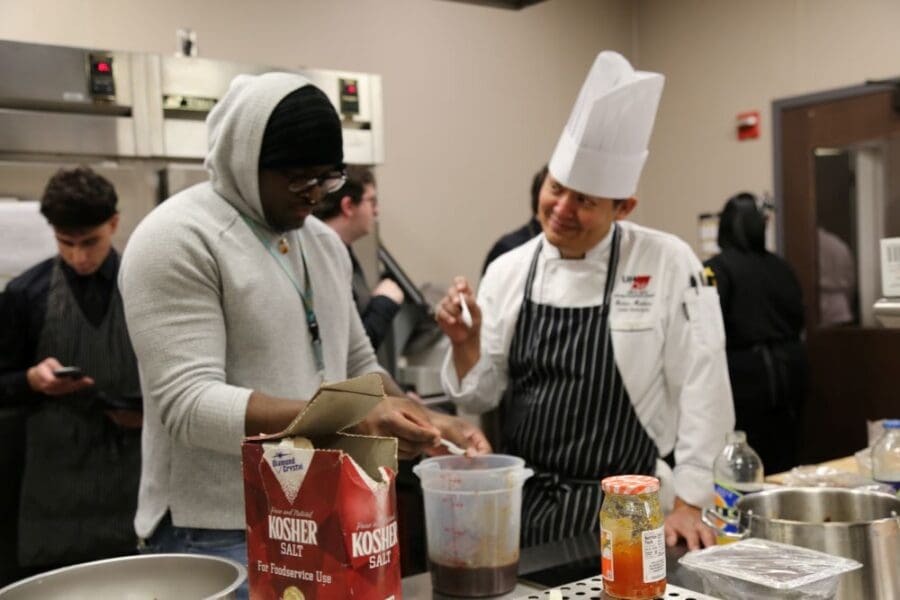 People taste testing a sauce in the lab kitchen