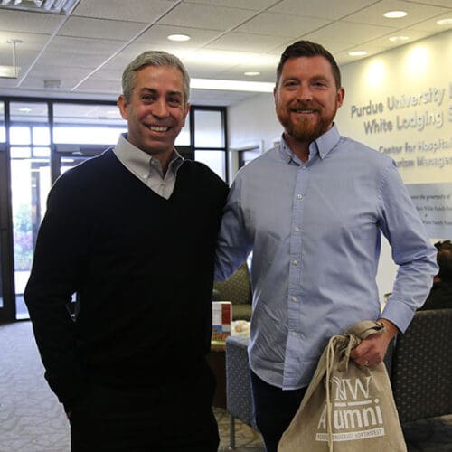 Scott Schaller poses with Brian Cheek in the lobby of the Hammond HTM Building