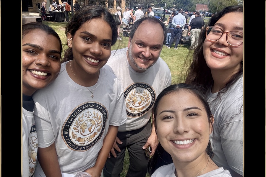 Five smiling people at outside at the Welcome Rally.