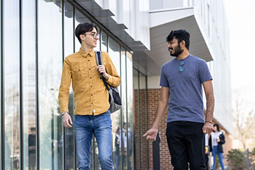 Students walk outdoors on PNW's campus