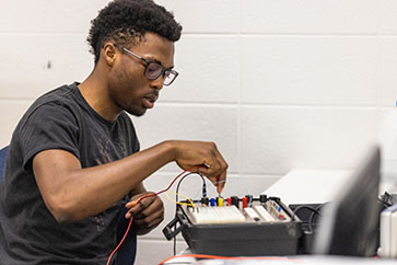 A PNW student experiments with circuits
