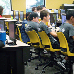 Students sit at computers during a summer camp