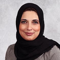 Rand Abdallah in a black headscarf.