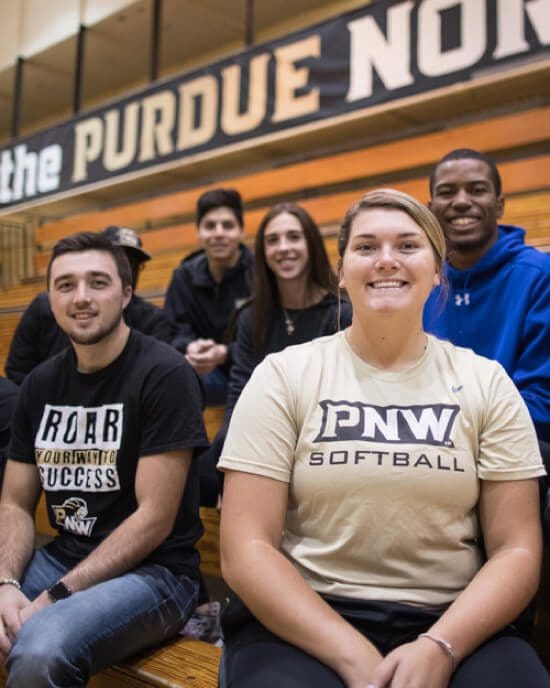 students sitting on bleachers