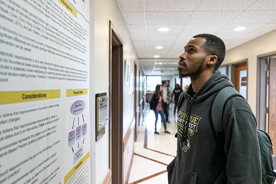 Tim Gilmore looking at a poster