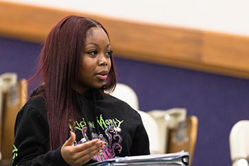 A PNW student listens in the classroom