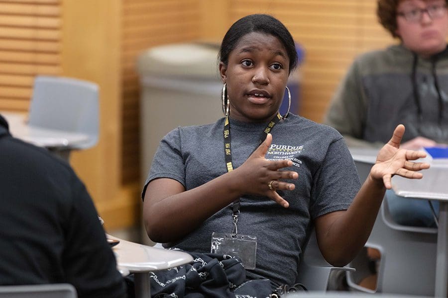 Female student speaks to class
