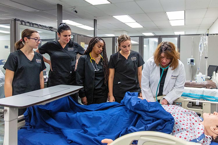 Purdue University Northwest students in a simulated care setting.