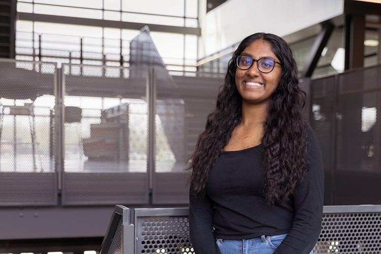 A Purdue University Northwest student poses on campus