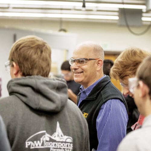 Jim Higley teaching a group of students