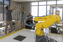 Students working around a robot