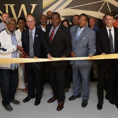 People gather during a ribbon-cutting on PNW's campus