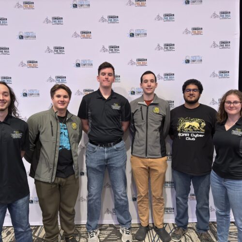 Five PNW students pose for photo at the Cyberforce Competition