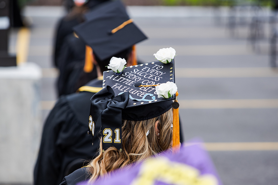 A decorated cap is pictured at commencement.