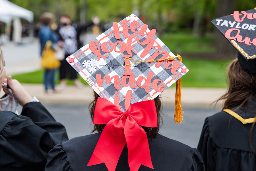 A decorated cap is pictured at commencement.