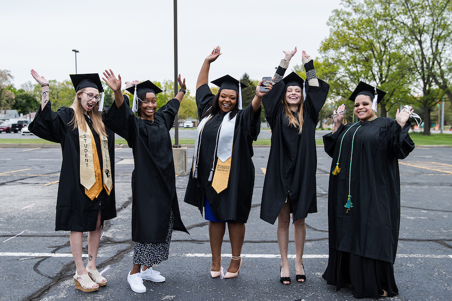 Grads are dancing at commencement.