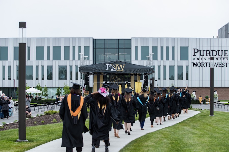 Students walking in commencement 2021.