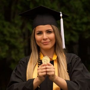 amy nieves with medallion is pictured