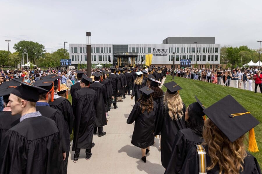 PNW Graduates marching toward the stage