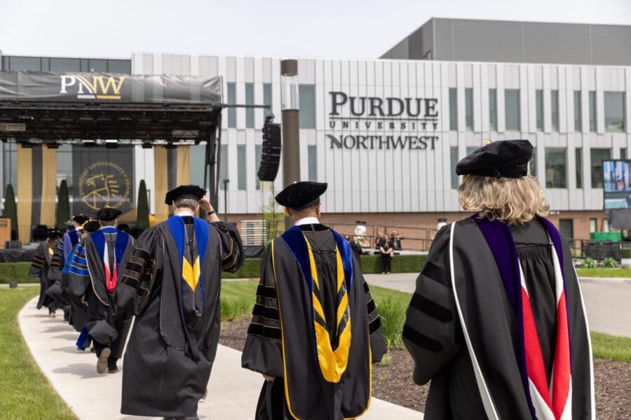 Faculty marching toward commencement stage