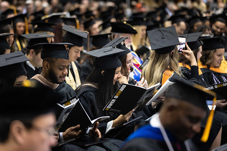 A crowd of graduates in their caps and gowns