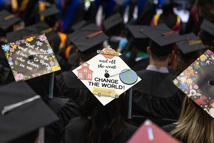 A decorated graduation mortar saying "Miss Feliciano and off she went to change the world."