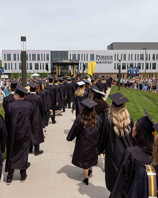 PNW graduates approach the Nils K. Nelson Bioscience Innovation Building