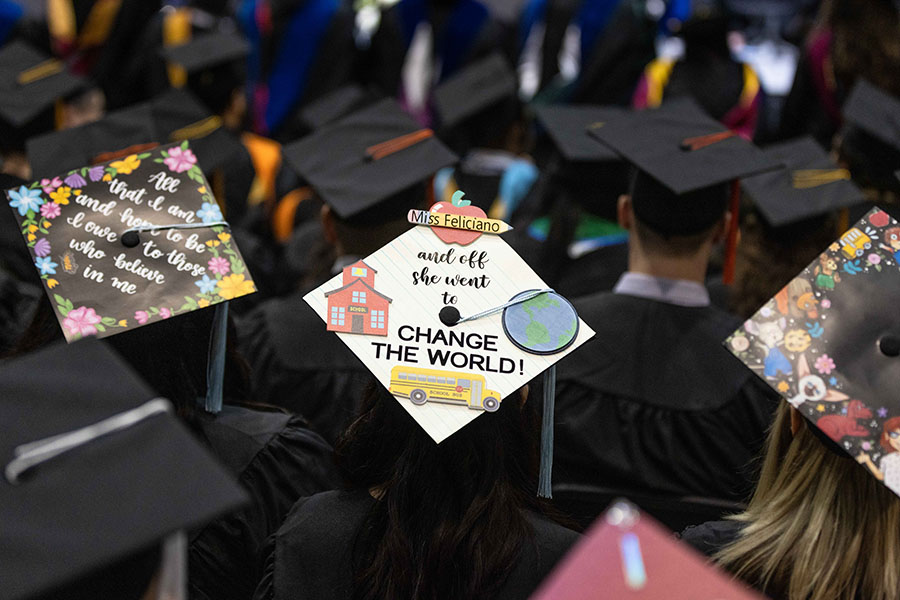 A decorated graduation mortar saying "Miss Feliciano and off she went to change the world."