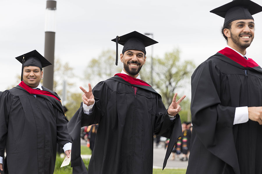 PNW graduates march in together