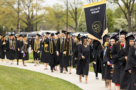 Students from PNW's College of Nursing march into commencement.