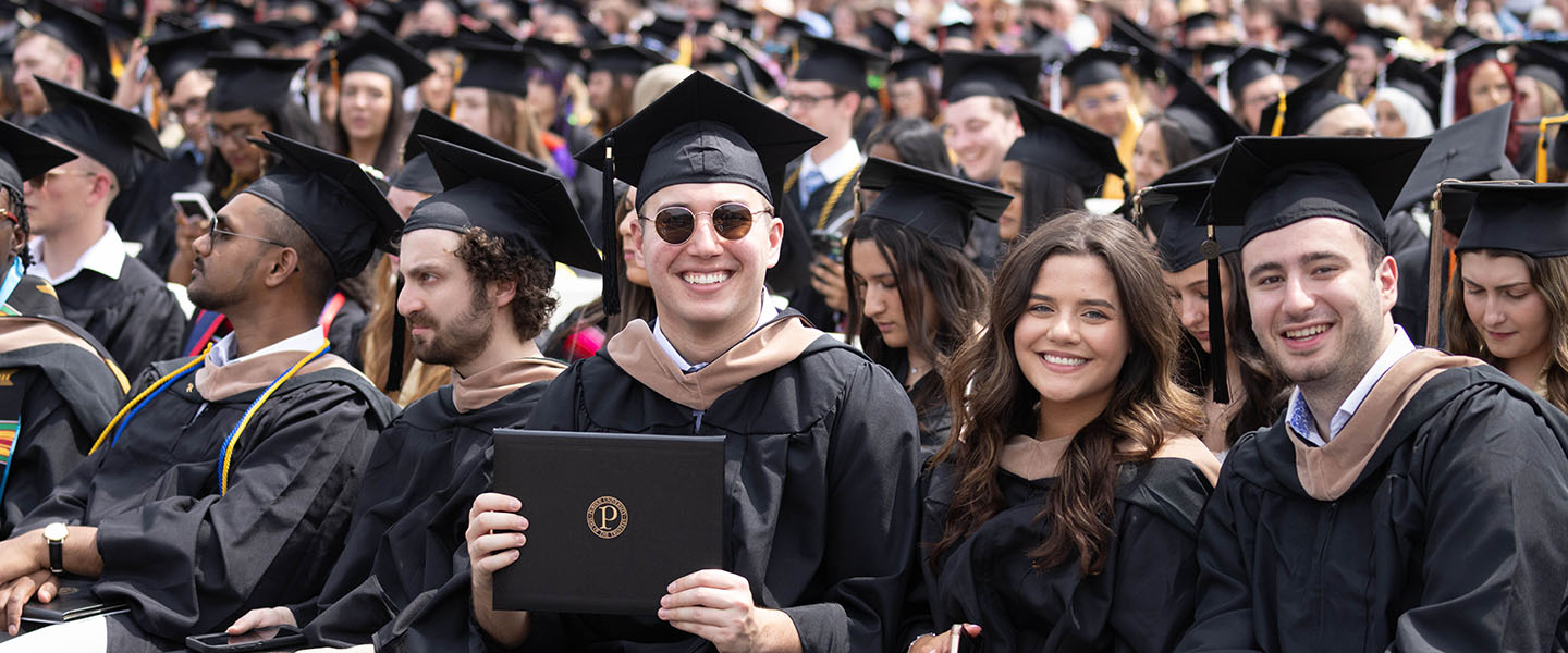 Graduates sit in the crowd at PNW's Spring 2025 commencement