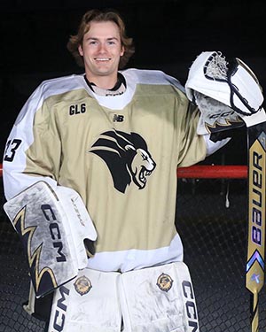 PNW Graduate Cooper Olson poses in hockey goalie gear