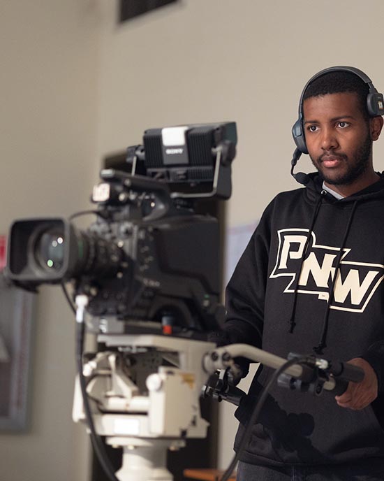 A PNW student films in the production studio