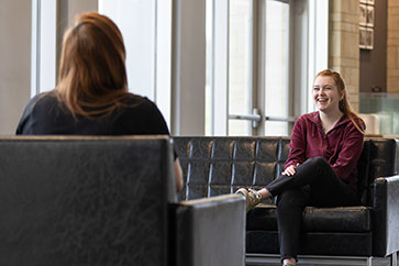 A PNW student talks with a friend.