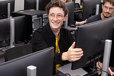 Room full of PNW students working on the computers in a computer lab 363x242