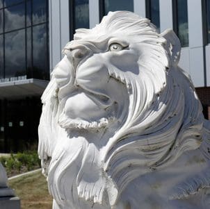 A lion sculpture outside PNW's Nils K Nelson Bioscience Innovation Building