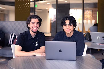 PNW students collaborate over a computer