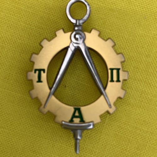 The Tau Alpha Pi pin