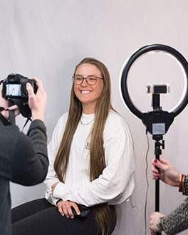 A student getting their photo taken at the Career center