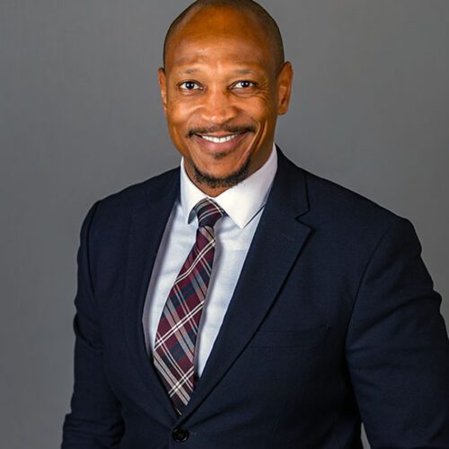 Richard Sévère in a suit and tie