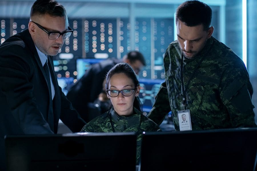 Government Surveillance Agency and Military Joint Operation. Male Agent, Female and Male Military Officers Working at System Control Center.