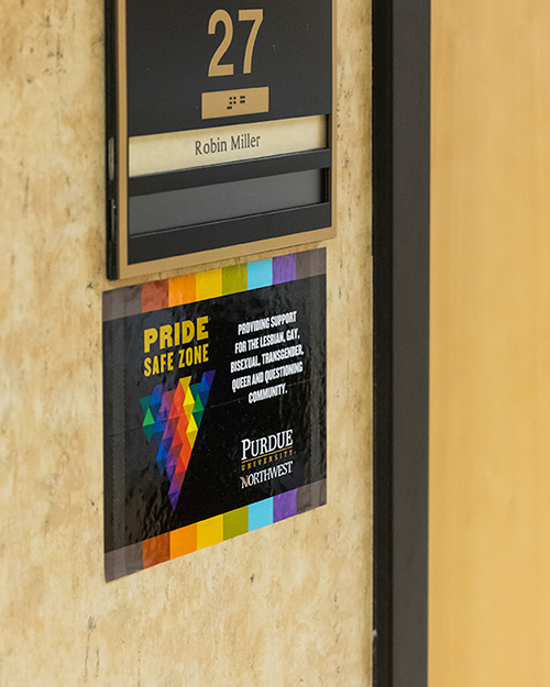 A pride safe zone sticker on a wall